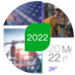 A circular photo collage showing solar panels, a utility worker wearing safety gear, power grid equipment, and graphic text, with a central green leaf-shaped icon containing the white text 2022