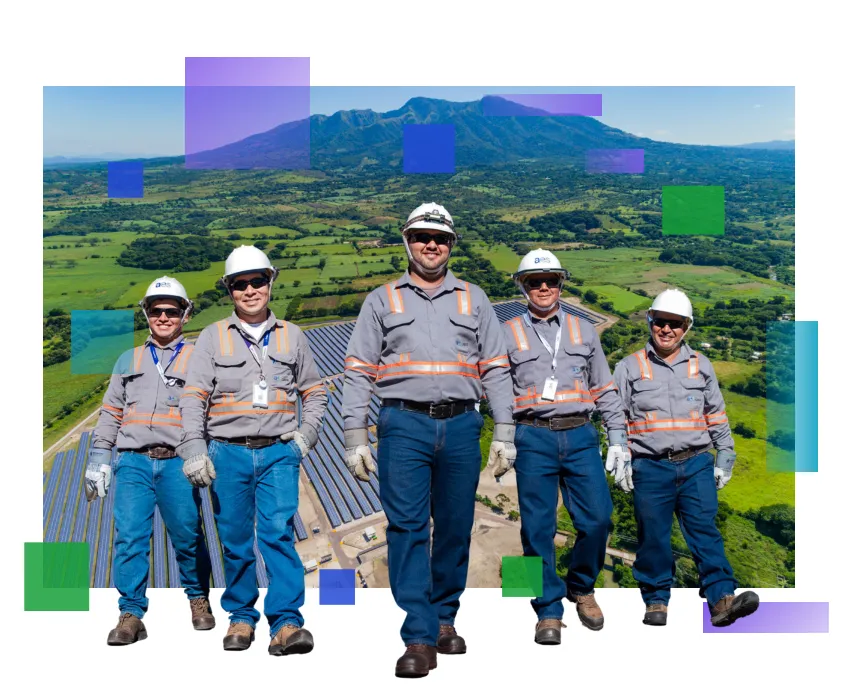 Five AES El Salvador workers in gray uniforms and white hard hats standing in front of a solar panel farm